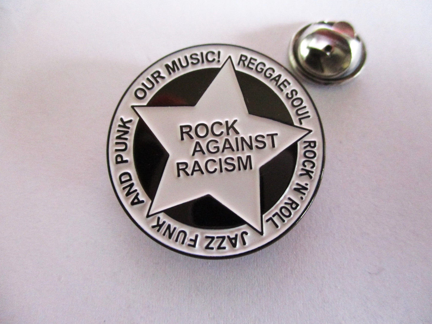 ROCK AGAINST RACISM metal badge (b&w)