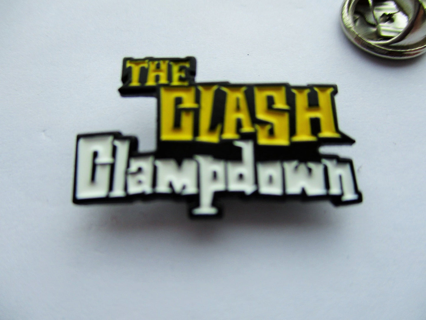 THE CLASH clampdown shaped PUNK METAL BADGE