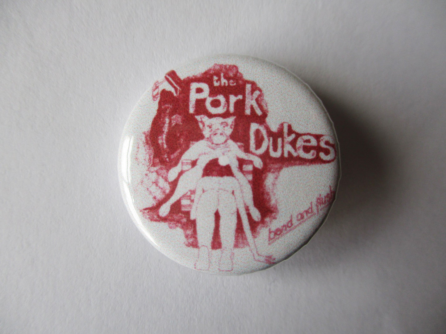 PORK DUKES bend & flush punk badge