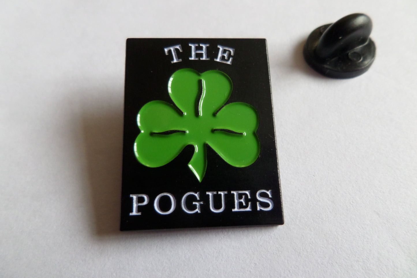 THE POGUES traditional logo/shamrock (black) EMBOSSED FOLK PUNK METAL BADGE - Savage Amusement